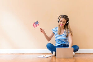 young girl waving small american flag