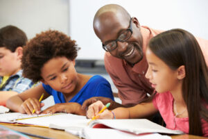 teacher working with young kids